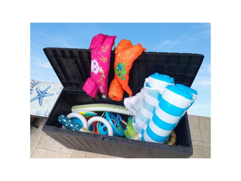 Outdoor deck box with pool toys, beach toys and floaties for little ones.