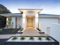 Facade and entry to a contemporary white rendered home in Australia